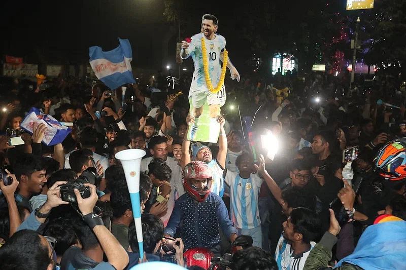 A fan with a cut out of Lionel Messi at TSC area in Dhaka University after Argentina won the FIFA World Cup 2022