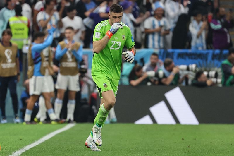 Argentina's goalkeeper #23 Emiliano Martinez celebrates after Argentina's forward #09 Julian Alvarez (unseen) scored his team's third goal during the Qatar 2022 World Cup football semi-final match between Argentina and Croatia at Lusail Stadium in Lusail, north of Doha on 13 December, 2022