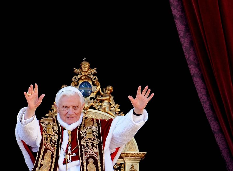 In this file photo taken on 25 December, 2011 Pope Benedict XVI delivers the "Urbi et Orbi" blessing from the balcony of St. Peter's basilica at the Vatican