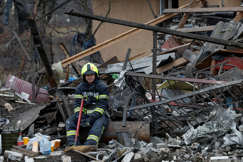 A rescuer rests at a site of a residential house damaged during a Russian missile strike, amid Russia's attack on Ukraine, in Kyiv, Ukraine 29 December, 2022.