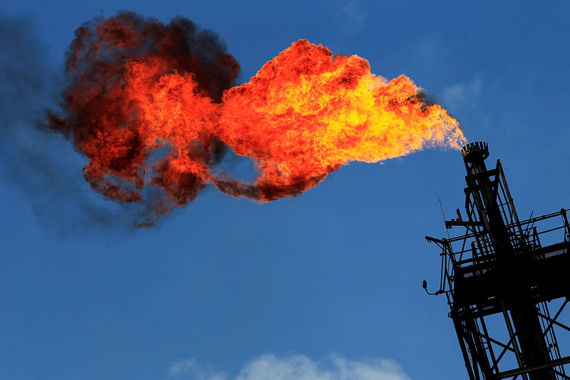 Excess natural gas is being flared, or burnt off, at a flare stack at the refinery in Tula 21 November, 2013