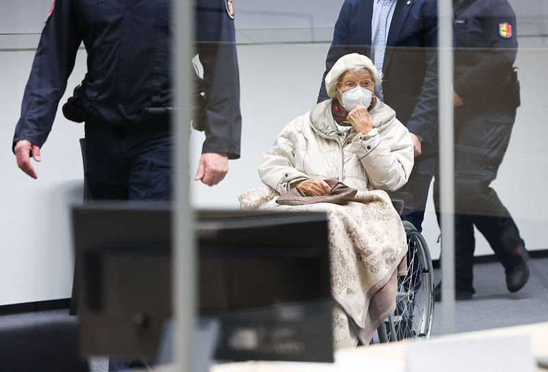 Defendant Irmgard F, a former secretary for the SS commander of the Stutthof concentration camp, is brought to a courtroom in Itzehoe, northern Germany, where her verdict was spoken on 20 December, 2022