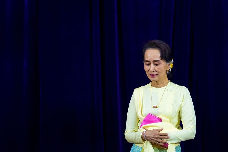 In this file photo taken on 28 August, 2018, Myanmar State Counsellor Aung San Suu Kyi leaves after delivering address before students of Yangon University general assembly in Yangon. A Myanmar junta court sentenced ousted civilian leader Aung San Suu Kyi to seven years in prison for corruption on 30 December, 2022, a legal source told AFP, ending the 18-month trial of the Nobel laureate.