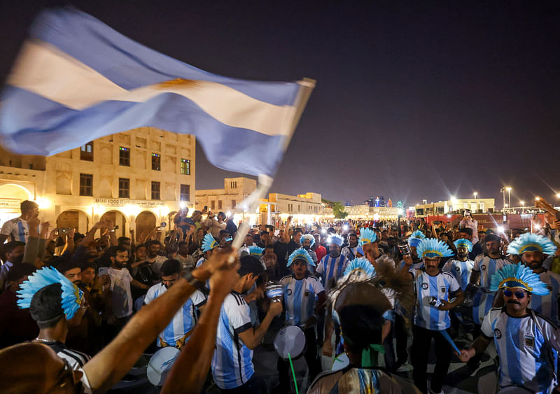 Argentina fans dance with drums at a popular tourist area in Souq Waqif, ahead of the FIFA World Cup 2022 soccer tournament in Doha, Qatar