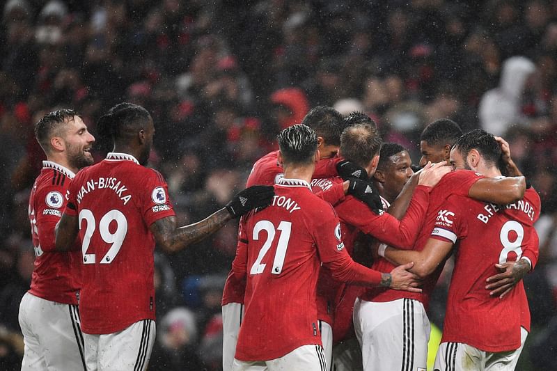 Manchester United's French striker Anthony Martial (C) celebrates with teammates after scoring his team second goal during the English Premier League football match between Manchester United and Nottingham Forest at Old Trafford in Manchester, north west England, on 27 December, 2022