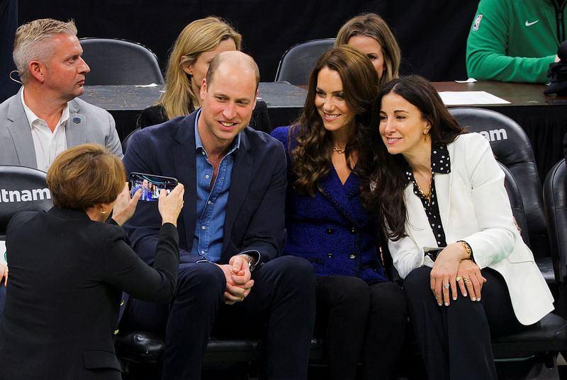 Governor-elect Maura Healey takes a picture of Britain's Prince William, Catherine, Princess of Wales, and wife of Celtics owner Wyc Grousbeck, Emilia Fazzalari, as they attend the Wednesday night National Basketball Association game between the seventeen-time World Champion Boston Celtics and the Miami Heat at TD Garden in downtown Boston, U.S., November 30, 2022