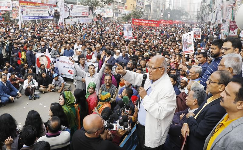 BNP standing committee member Khandaker Mosharraf Hossain addresses the party's mass rally in city on 30 December