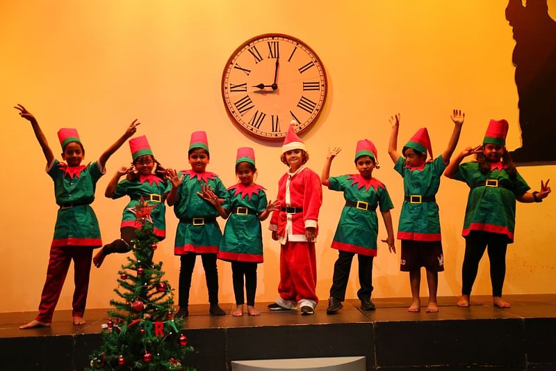 Children perform a play adapted from Charles Dickens's Christmas classic, 'A Christmas Carol' at International School Dhaka on Wednesday, 14 December 2022.