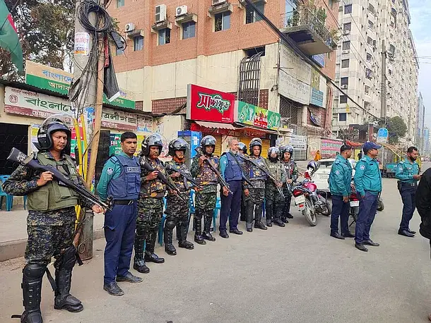 The policemen remain alert in the Shia Masjid area around 8:00am on 10 December, 2022.