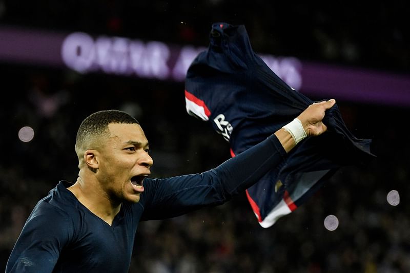 Paris Saint-Germain's French forward Kylian Mbappe celebrates after scoring a penalty during the French L1 football match between Paris Saint-Germain FC and RC Strasbourg Alsace at The Parc des Princes stadium in Paris on 28 December, 2022