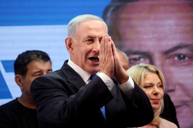 Former Israeli Prime Minister Benjamin Netanyahu gestures as he addresses his supporters from a truck at a campaign event in the run up to Israel’s election in Or Yehuda, Israel on 30 October, 2022