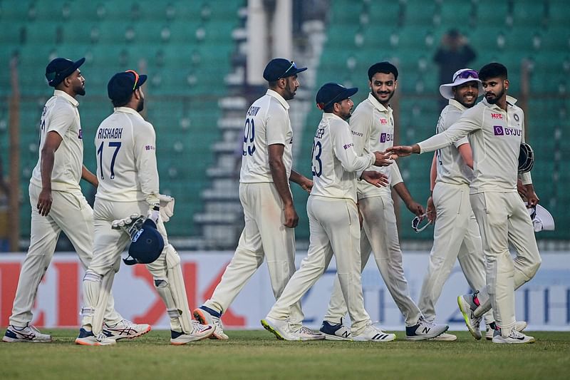 India's cricketers walk back to the pavilion after end of play of the second day of the first cricket Test match between Bangladesh and India at the Zahur Ahmed Chowdhury Stadium in Chittagong on 15 December 2022.