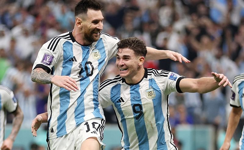 Argentina's Julian Alvarez celebrates with Lionel Messi scoring their second goal against Croatia