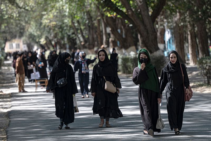 In this file photo taken on 13 October 2022, Afghan female students arrive for entrance exams at Kabul University in Kabul. Afghanistan's Taliban rulers on 20 December, 2022 banned university education for females nationwide, as the hardline Islamists continue to crush women’s right to education and freedom