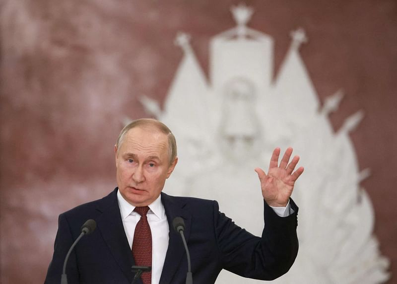 Russian President Vladimir Putin gestures as he attends a news conference following a meeting of the State Council on implementing the youth policy in current conditions, at the Kremlin in Moscow on December 22, 2022