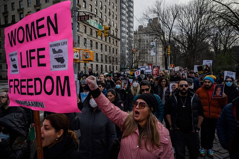 Activists march during a protest in remembrance of victims of flight Ukraine International Airlines flight PS752, that was shot down by the Islamic Revolutionary Guard Corps after takeoff from Tehran, and calling for regime change in Iran, in New York on 8 January 2022.