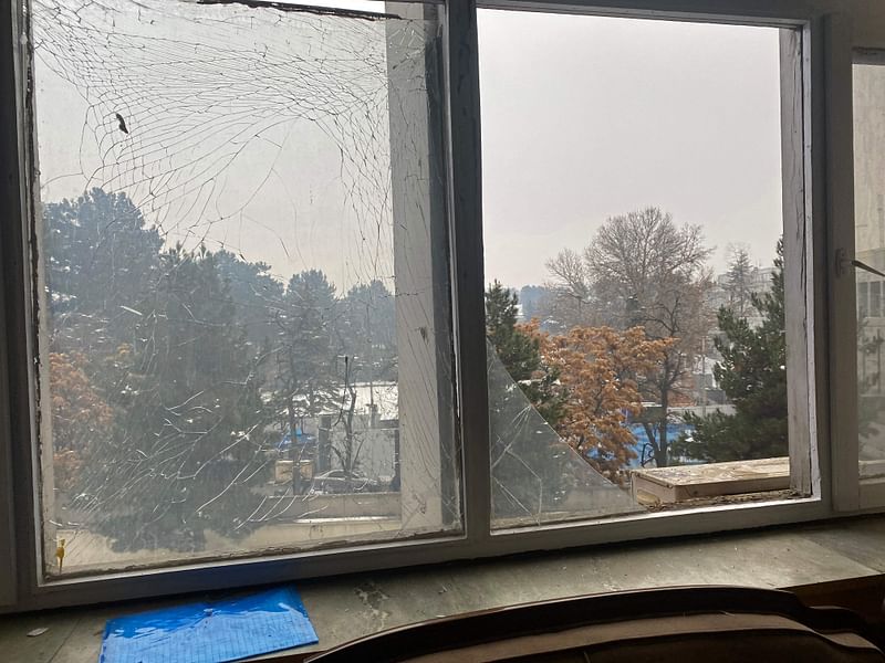 The broken windowpanes of a building are pictured after a suicide blast near Afghanistan’s foreign ministry in Kabul on 11 January, 2023