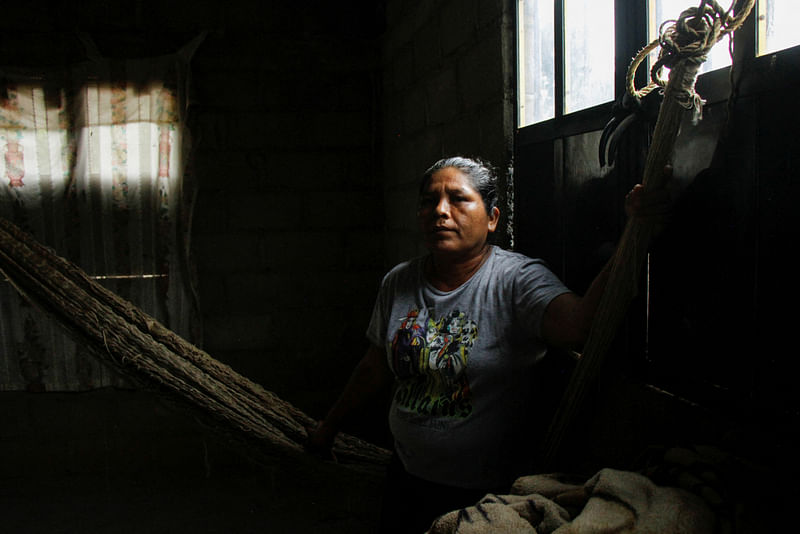 Marilu Sanchez, wife of late journalist Gustavo Sanchez, who was killed by assailants while riding his motorcycle with his son, poses for a photo at her home in Morro de Mazatan, in Oaxaca state, Mexico, October 18, 2022