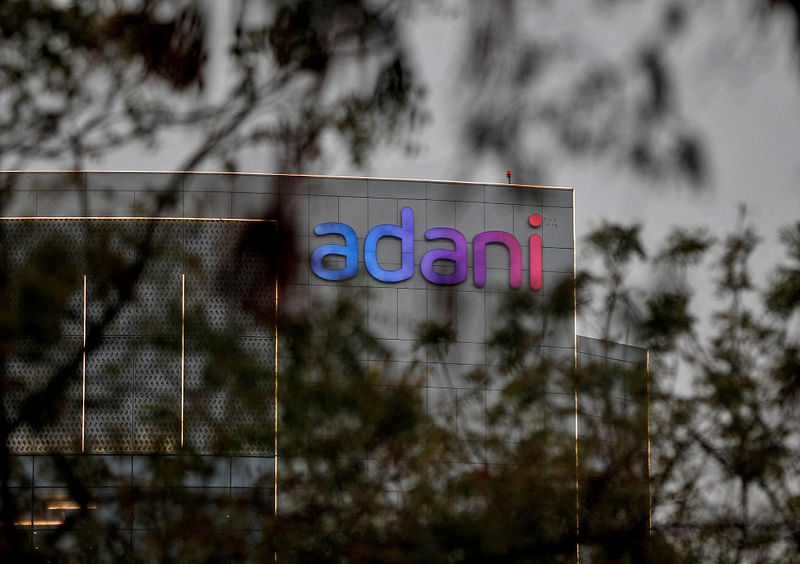 The logo of the Adani Group is seen on the facade of its Corporate House on the outskirts of Ahmedabad, India, 27 January 2023.