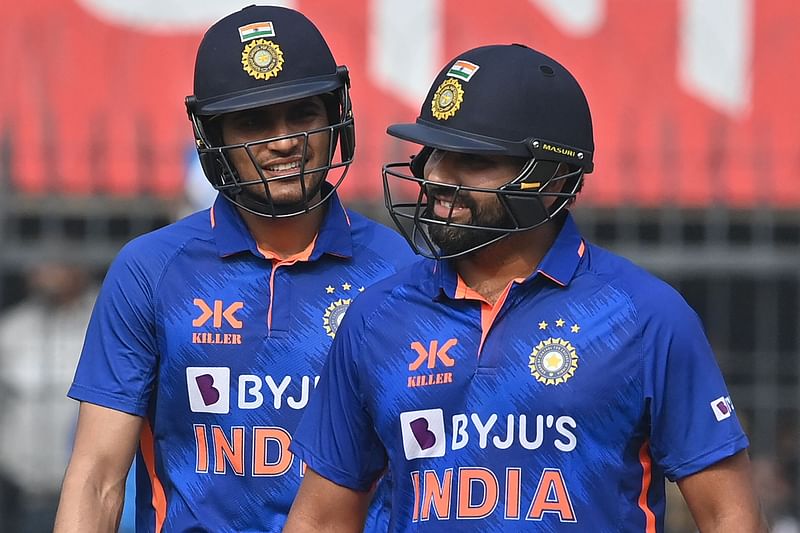 India's captain Rohit Sharma (R) and Shubman Gill gesture during the third and final ODI between India and New Zealand at the Holkar Cricket Stadium in Indore on 24 January, 2023