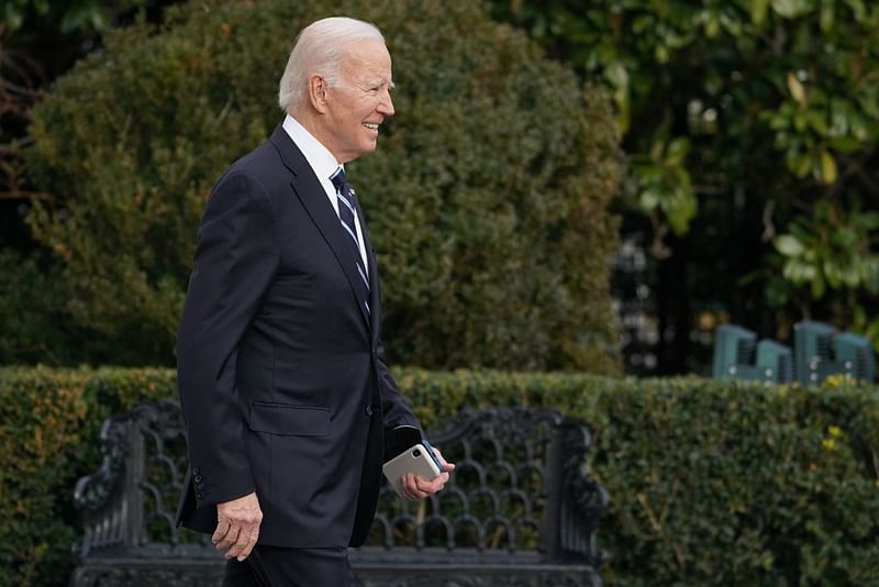 US President Joe Biden makes his way to board Marine One before departing from the White House in Washington, DC on 13 January, 2023. Biden is headed to Wilmington, Delaware to spend the weekend at his residence.