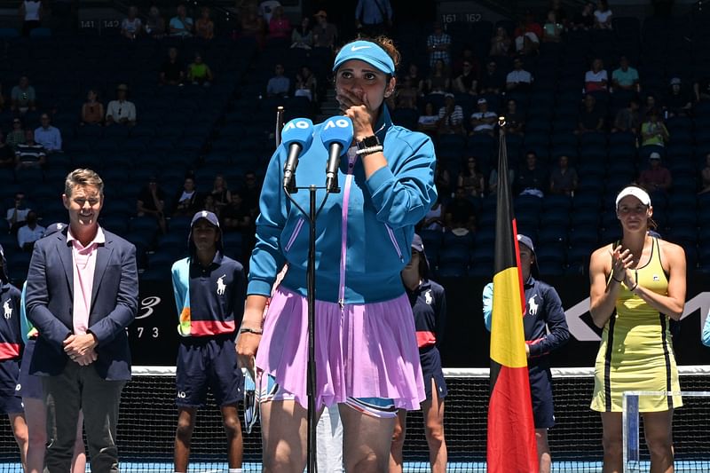 India's Sania Mirza reacts as she speaks during the awards ceremony after defeat against Brazil's Luisa Stefani and Rafael Matos during the mixed doubles final on day twelve of the Australian Open in Melbourne on 27 January, 2023