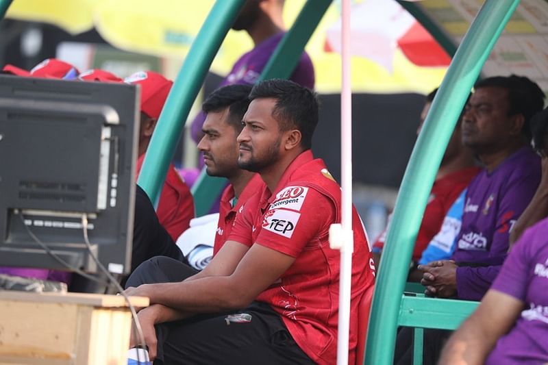 Fortune Barishal captain Shakib Al Hasan looks on from the dugout during their match against Chattogram Challengers in BPL9 at the Zahur Ahmed Chowdhury Stadium in Chattogram on 13 January, 2023