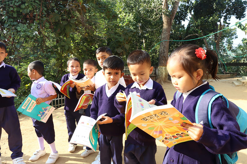 Children are happy after getting new books. The picture was taken from Vedvedi government primary school in Rangamati on 4 January.