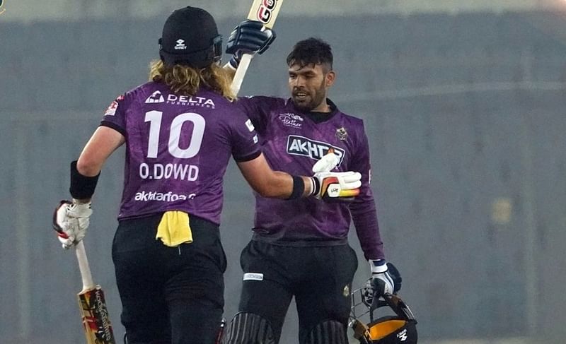 Chattogram Challenegers batter Usman Ghani celebrates after completing his fifty with teammate Max O'Dowd against Khulna Tigers in the ninth Bangladesh Premier League at the Sher-e-Bangla National Cricket Stadium in Dhaka on 9 January, 2023