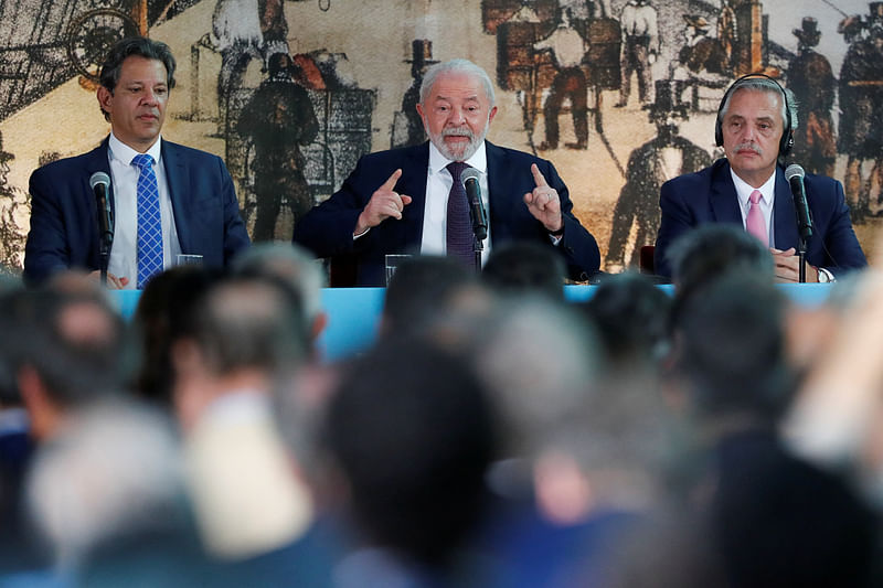 Brazil's President Luiz Inacio Lula da Silva, Argentina's President Alberto Fernandez and Brazil's Finance Minister Fernando Haddad attend a meeting with Brazilian and Argentine business representatives, at the Casa Rosada presidential palace in Buenos Aires, Argentina, January 23, 2023