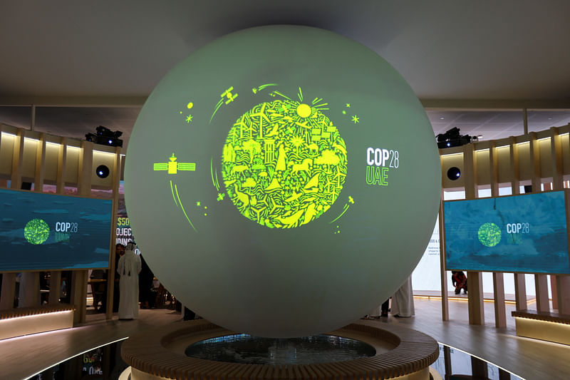 A view shows the 'Cop28 UAE' logo on a globe, during Abu Dhabi Sustainability Week (ADSW), in Abu Dhabi, UAE, 17 January, 2023.