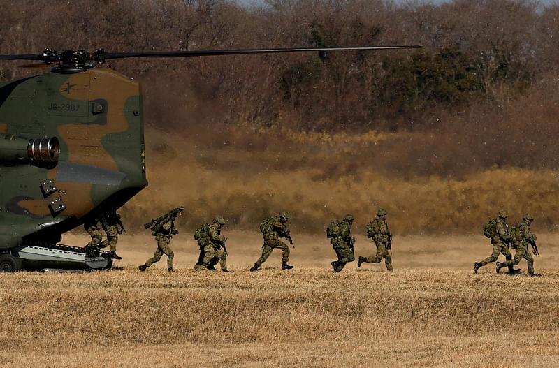 Member of Japan’s Ground Self-Defense Force 1st Airborne Brigade take part in a new year joint military drill among Japan, US, Britain and Australia at Narashino exercise field in Funabashi, east of Tokyo, Japan on 8 January, 2023