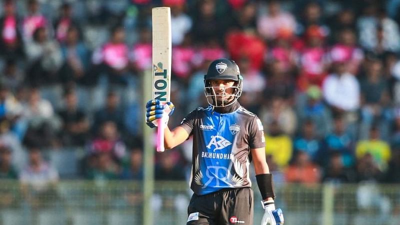 Rangpur Riders batsman Mahedi Hasan raises his bat after completing his half-century against Dhaka Dominators in the Bangladesh Premier League (BPL) 2023 at the Sylhet International Cricket Stadium on 30 January, 2023