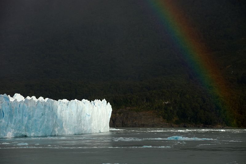 In this file photo taken on 12 March, 2018, a rainbow appears over the Perito Moreno Glacier at Parque Nacional Los Glaciares near El Calafate, Argentina