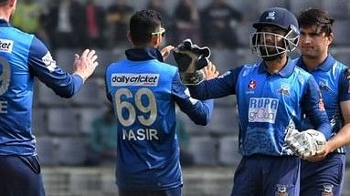 Dhaka Dominators captain Nasir Hossain celebrates with teammates after taking a wicket during their BPL9 match against Fortune Barishal at the Sylhet International Cricket Stadium on 31 January, 2023