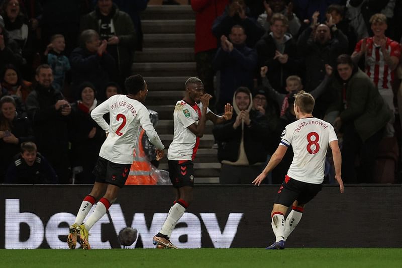 Southampton's Malian midfielder Moussa Djenepo (C) celebrates scoring the team's second goal during the English League Cup quarter-final football match between Southampton and Manchester City at St Mary's Stadium in Southampton, southern England on 11 January, 2023