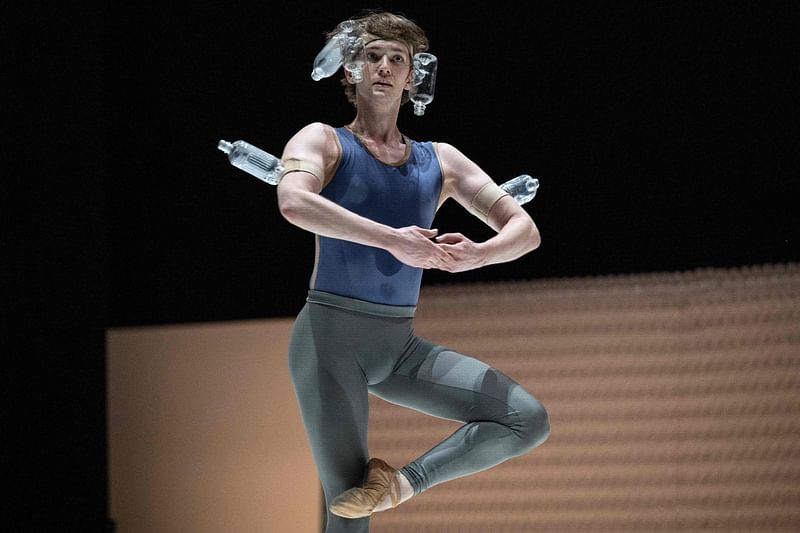 This photo taken on 7 January, 2023 shows US ballet dancer and guest star Julian MacKay taking part in the dress rehearsal for the "PET Bottle Labyrinth", one half of an innovative two-part performance by the K-BALLET dance company entitled "Plastic" to highlight the issue of plastic pollution, at the Kanagawa Arts Theatre in Yokohama, south of Tokyo.