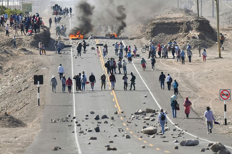 Demonstrators hold a blockade in the Pan-American highway at La Joya to demand the resignation of Peruvian President Dina Boluarte in Arequipa, Peru on 12 January, 2023