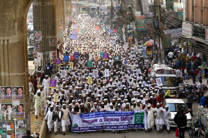 In this photograph taken on 21 January, 2023, members of Islamist party ‘Islami Oikyojote’ demonstrate demanding the National Curriculum and Textbook Board (NCTB) scrap changes in the transgender inclusive books for schools in Dhaka