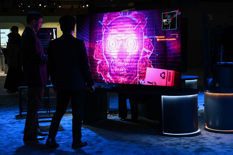 Attendees view a video game on a Samsung Electronics Co. Gaming Hub enabled smart TV that does not require a video game console displayed during a media preview ahead of the Consumer Electronics Show (CES) of Las Vegas, Nevada on 3 January, 2023.