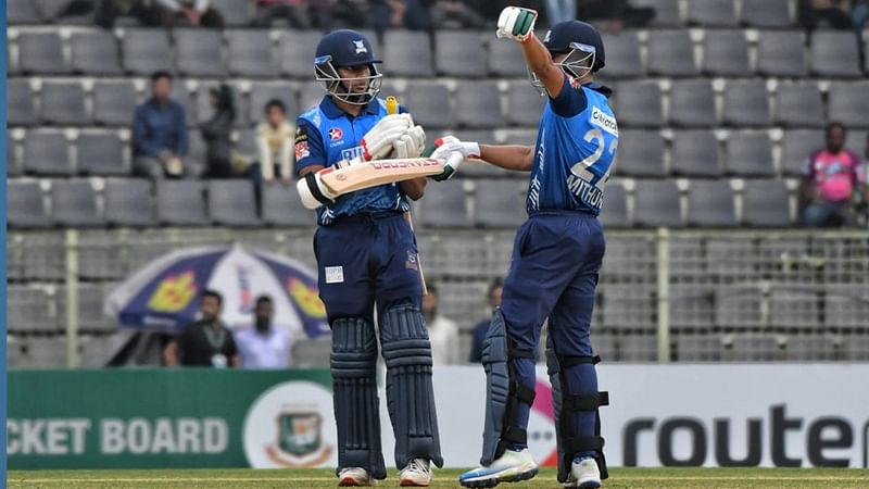 Dhaka Dominators batter Mohammad Mithun raises his bat after completing his fifty against Fortune Barishal in their BPL9 match at the Sylhet International Cricket Stadium on 31 January, 2023