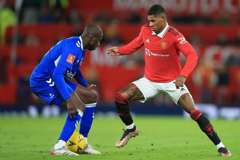 Everton's French midfielder Abdoulaye Doucoure vies with Manchester United's English striker Marcus Rashford during the English FA Cup third round match between Manchester United and Everton at Old Trafford in Manchester, England, on 6 January, 2023