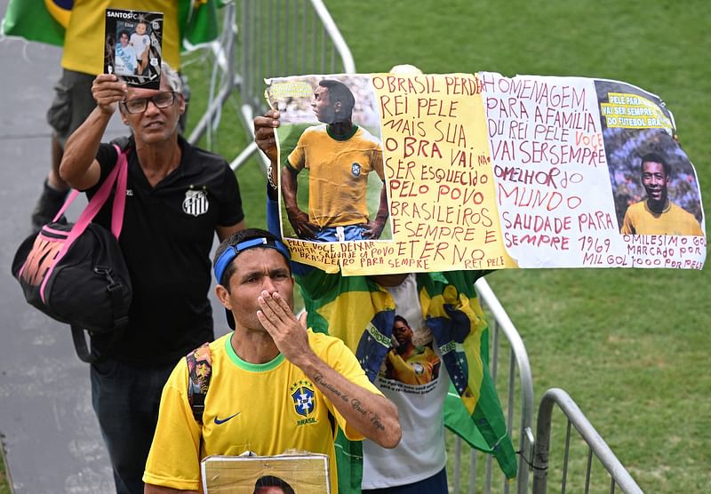 Fans of late Brazilian football legend Pele attend his wake at the Urbano Caldeira stadium in Santos, Sao Paulo, Brazil on 2 January, 2023