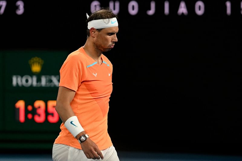 Spain's Rafael Nadal reacts as he leaves for a medical time out during his men's singles match against Mackenzie McDonald of the US on day three of the Australian Open in Melbourne on 18 January, 2023