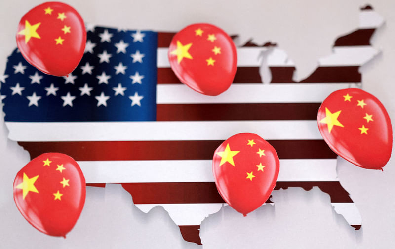 Printed balloons with Chinese flag are placed on US flag in the shape of US map outline, in this illustration taken 5 February, 2023.