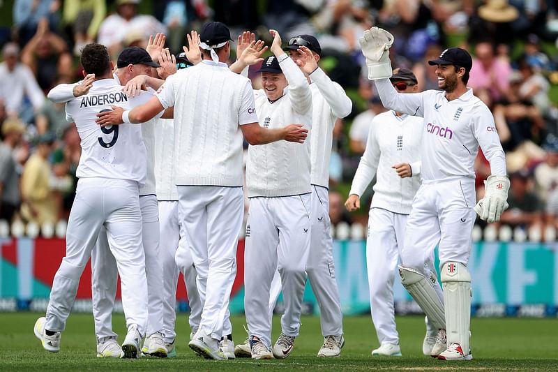 England players celebrate New Zealand's Kane Williamson being caught during day two of the second Test between New Zealand and England at the Basin Reserve in Wellington on 25 February 2023