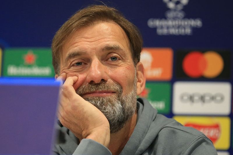 Liverpool's German manager Jurgen Klopp smiles during a press conference at Anfield Stadium in Liverpool, north-west England on 20 February, 2023, on the eve of the UEFA Champions League round of 16 first leg football match against Real Madrid