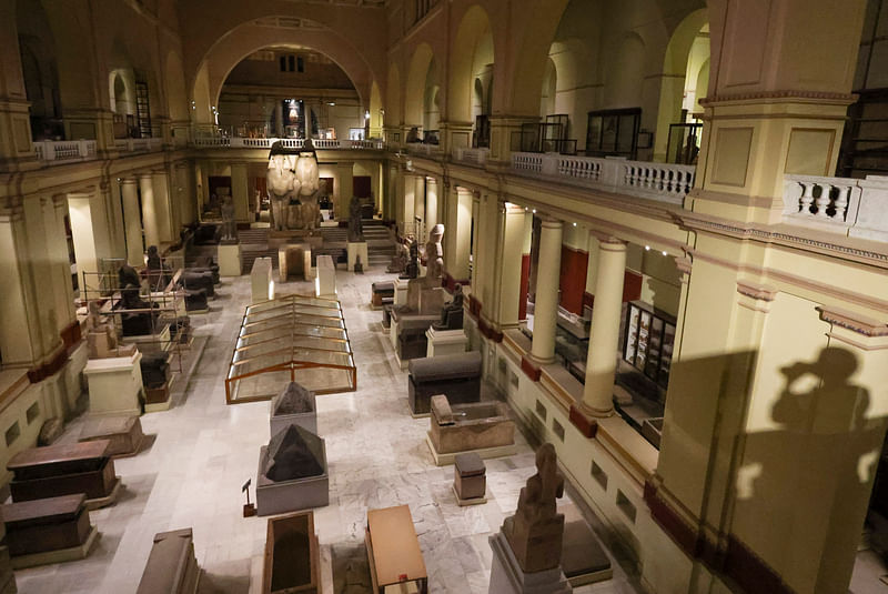 A shadow of a media member is seen next to different pharaonic artefacts following conference at the Egyptian Museum after opening of the newly renovated wing in the 120-year-old Egyptian museum in Egypt's capital of Cairo, Egypt 20 February 2023.