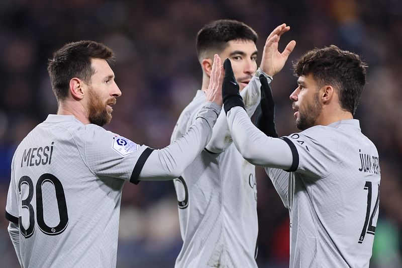 Paris Saint-Germain's Argentine forward Lionel Messi is congratulated by teammates after scoring a goal during the French L1 football match between Montpellier Herault SC and Paris Saint-Germain (PSG) at Stade de la Mosson in Montpellier, southern France on 1 February, 2023