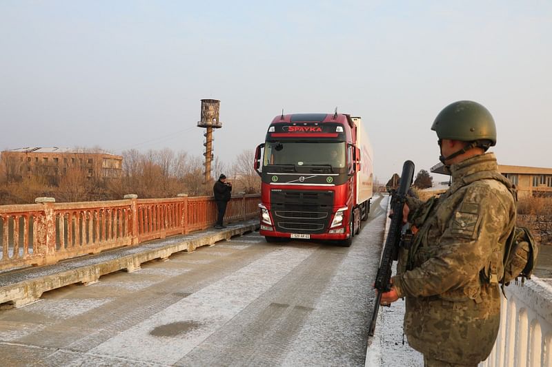 Trucks are passing through the Alican checkpoint at the Turkish side of the Aras river separating the two countries.